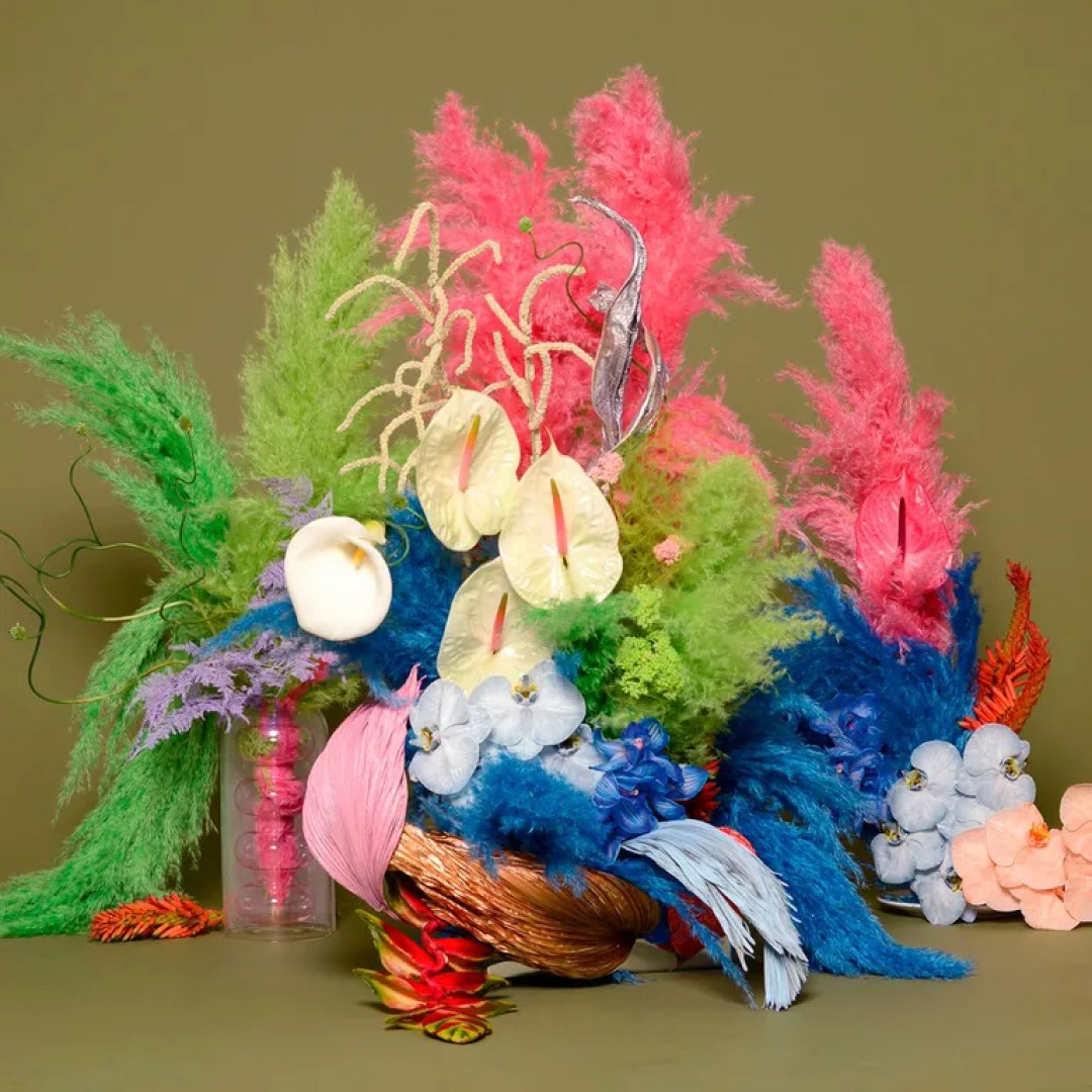 brrch flowers bouquet of colourful flowers and feathers against green background