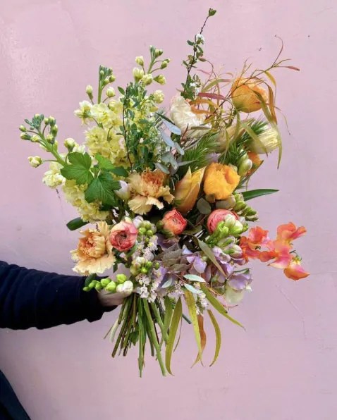 Yellow, green, pink, and purple floral arrangement by Désirée Fleurs in Paris